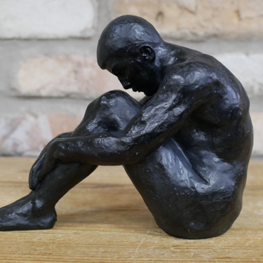 Small Sitting Man