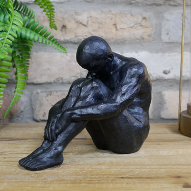 Small Sitting Man